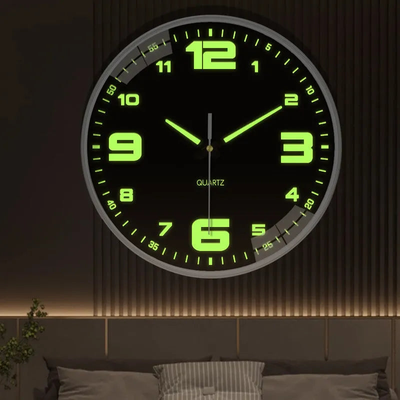 Modern 8 inch circular wall clock with luminous numerals on a white wall