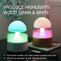 White cloud-shaped humidifier with rainfall effect and colour changing night light