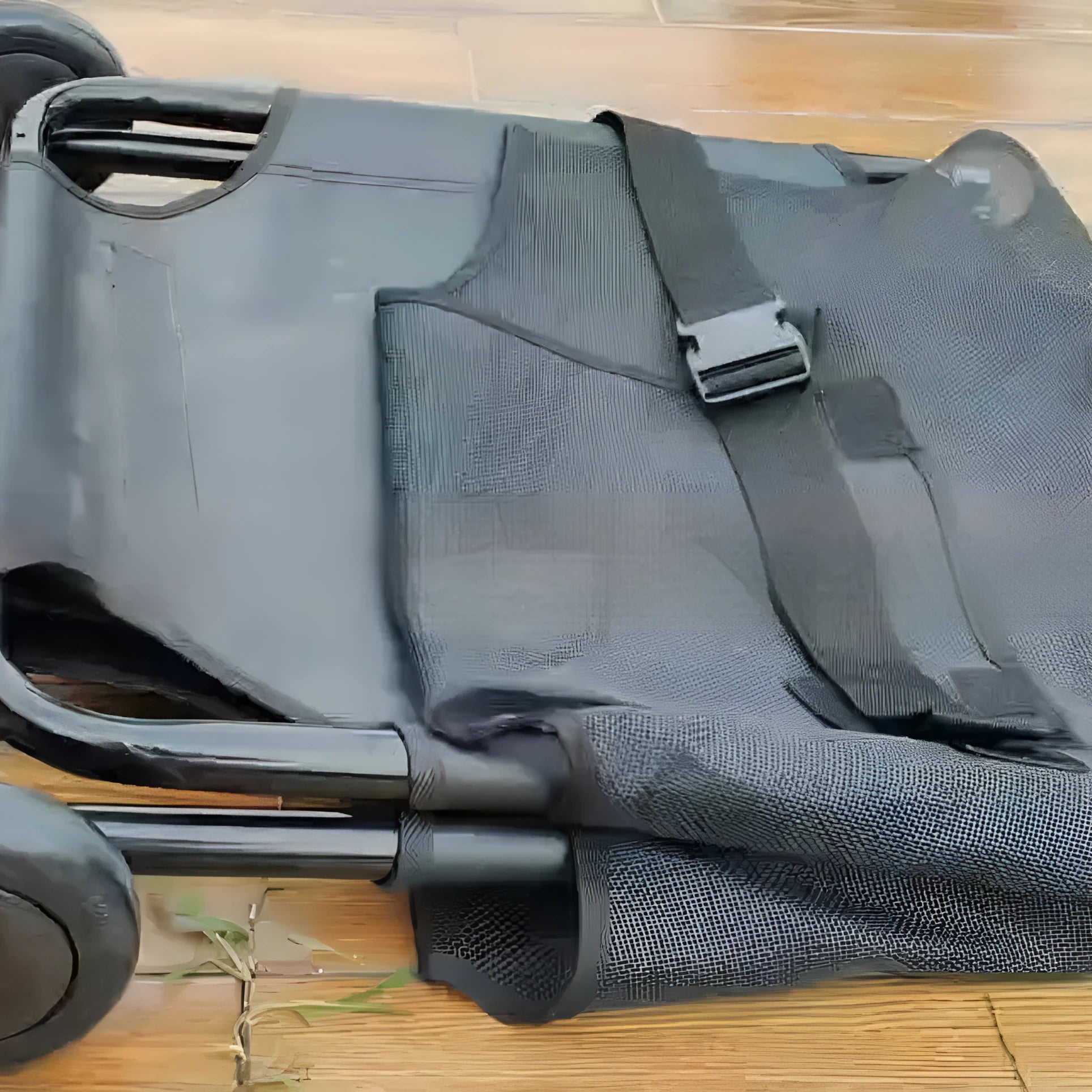 Large black aluminium alloy folding stretcher for emergency transport of dogs