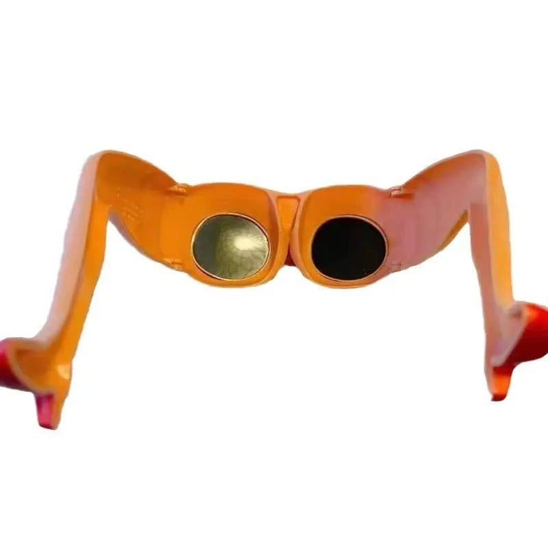 Orange plastic novelty sunglasses shaped like a pair of legs, on a white background.