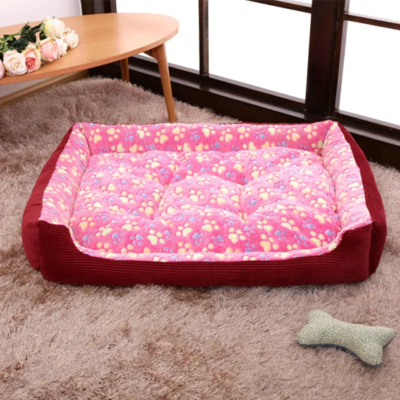 Beige plush sofa dog bed with raised rim for a small dog, showing non-slip base.
