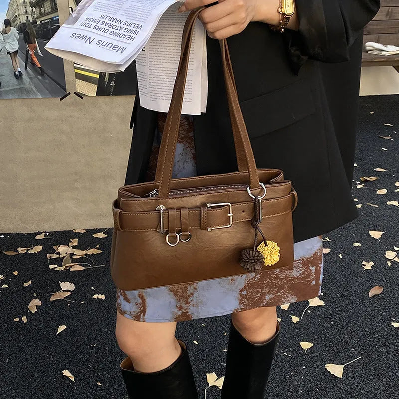 Women's retro belt buckle shoulder bag in PU, horizontal square shape, black or brown, with splicing detail.
