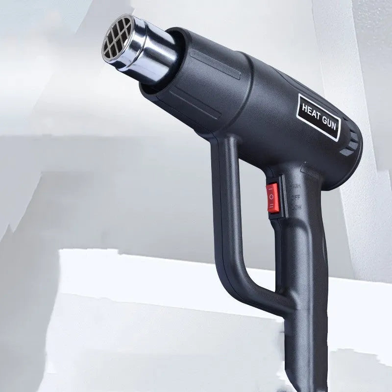 Black and silver 2000W industrial hot air tool with grid air outlet and thermal grip.