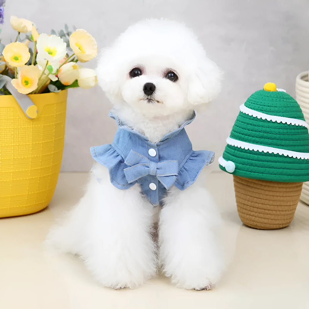 Dark blue denim dog dress with ruffles and a metal leash hook on the chest.