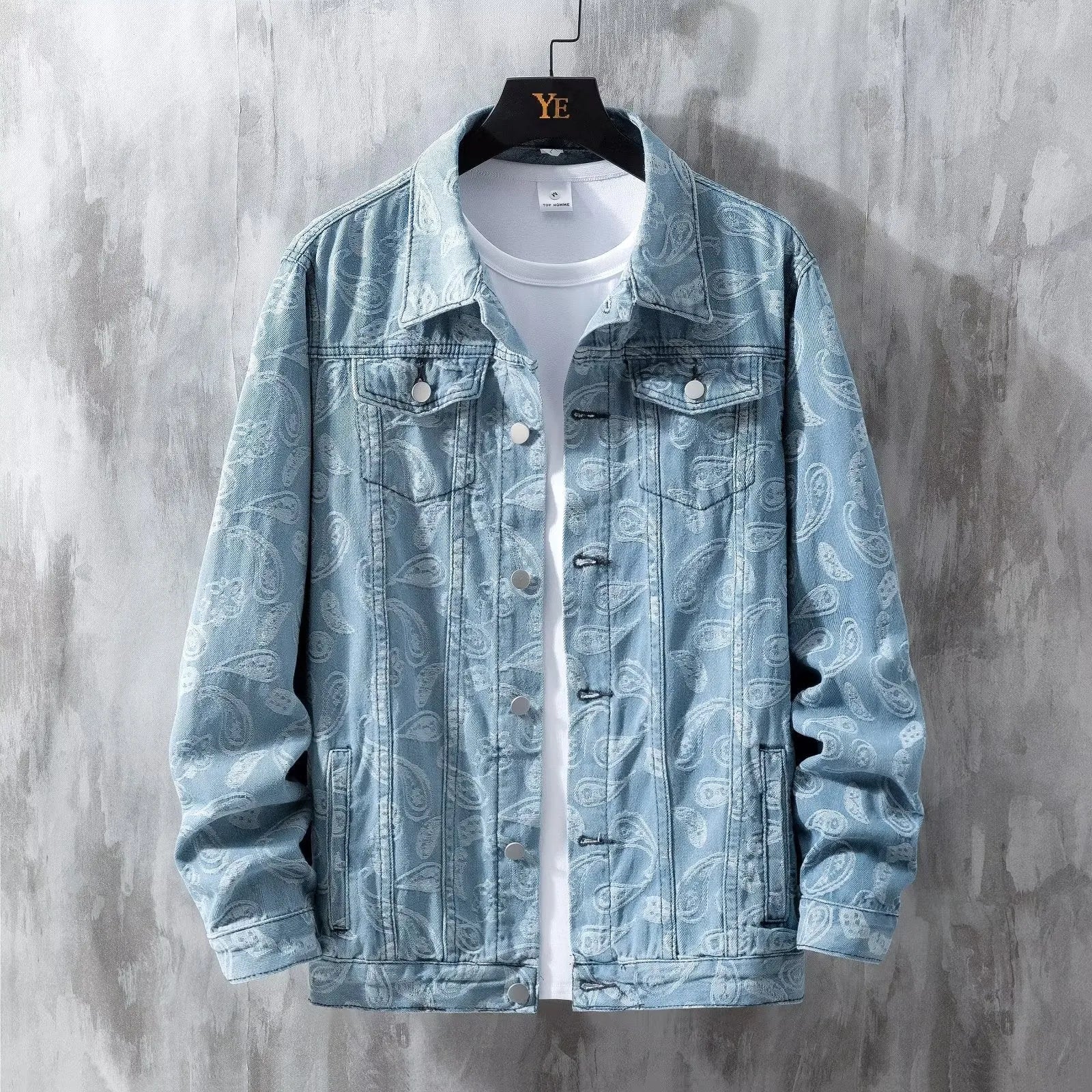 A slim fit men's denim coat in street fashion style, shown in a light blue colour with patch pockets.