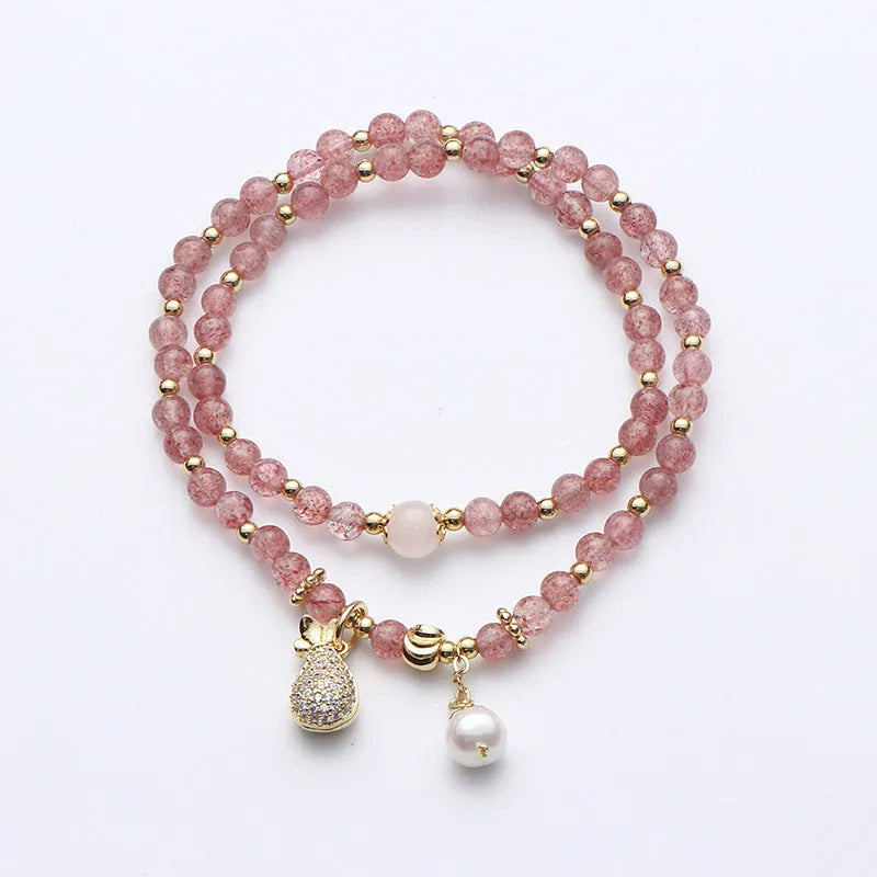 Women's strawberry quartz crystal bracelet with geometric shapes for money drawing