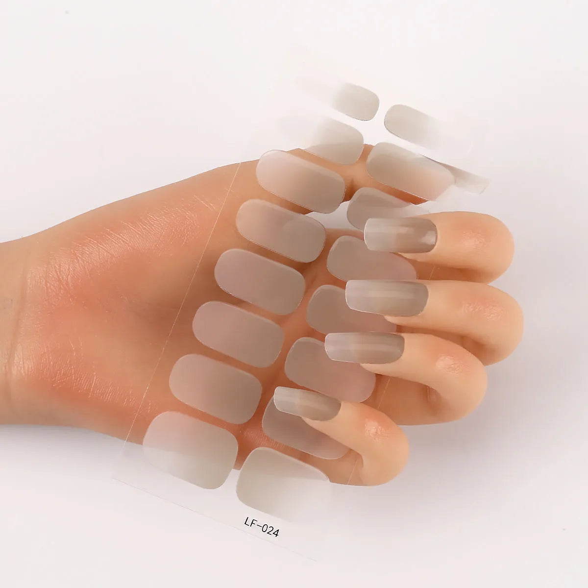 16 solid colour full nail art stickers with 22 patterns including cross, rose, butterfly designs in 12x6mm oval size