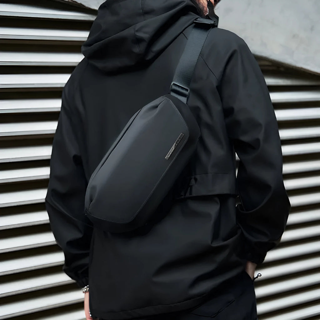 Black men's messenger bag in oxford cloth with cross-body strap and street style details
