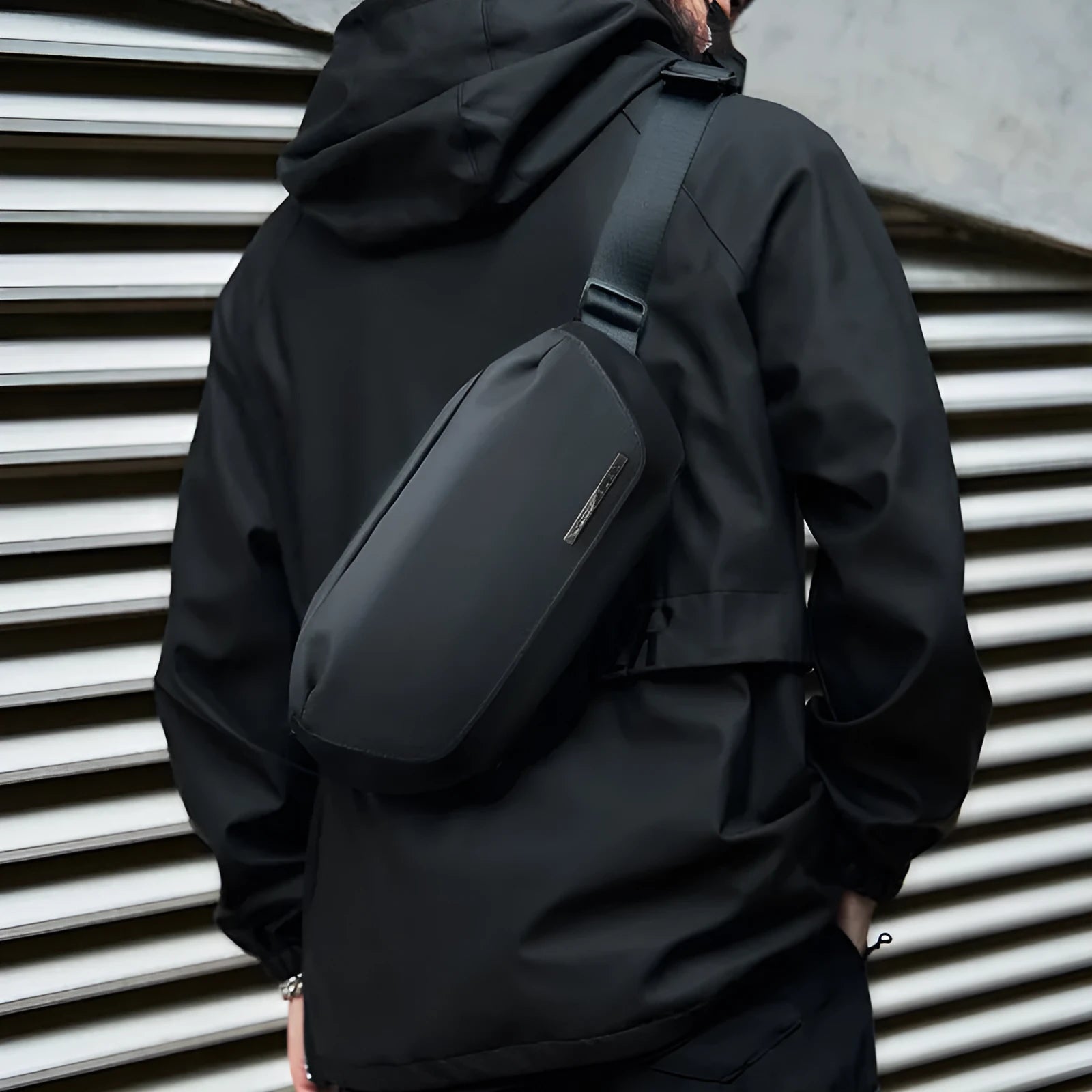 Black men's messenger bag in oxford cloth with cross-body strap and street style details
