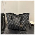 PU leather shoulder bag with sewing thread detail in black, shown with measurements.