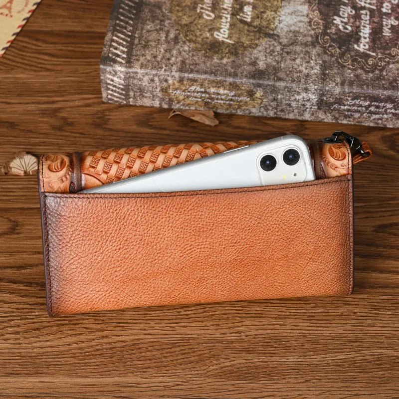 Retro brown women's tri-fold wallet with embossed floral pattern, showing interior card slots and coin compartment.