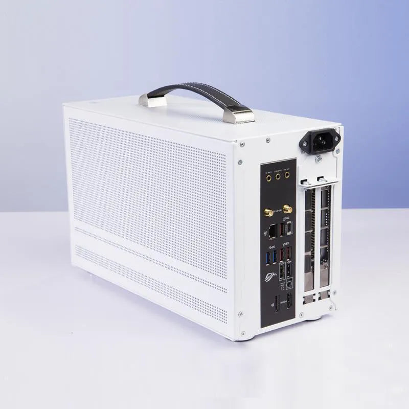Three Hummingbird Portable mini-ITX steel computer case in titanium grey on a desk
