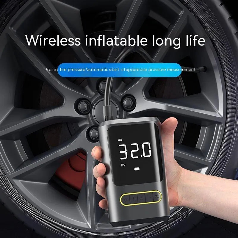 Handheld black digital display wireless car air pump with LED light and nozzle adapters.