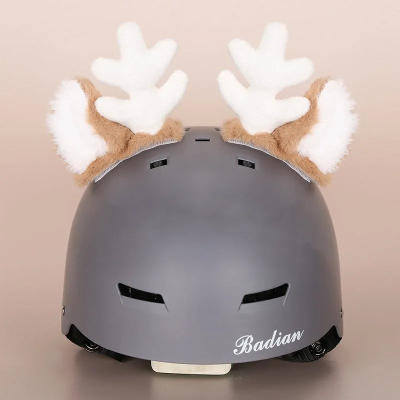Colourful plush cartoon hat decoration sitting on top of a ski helmet