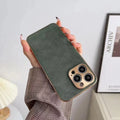 Leather texture grey-green TPU phone case fitted on an iPhone showing precise button and camera cutouts.