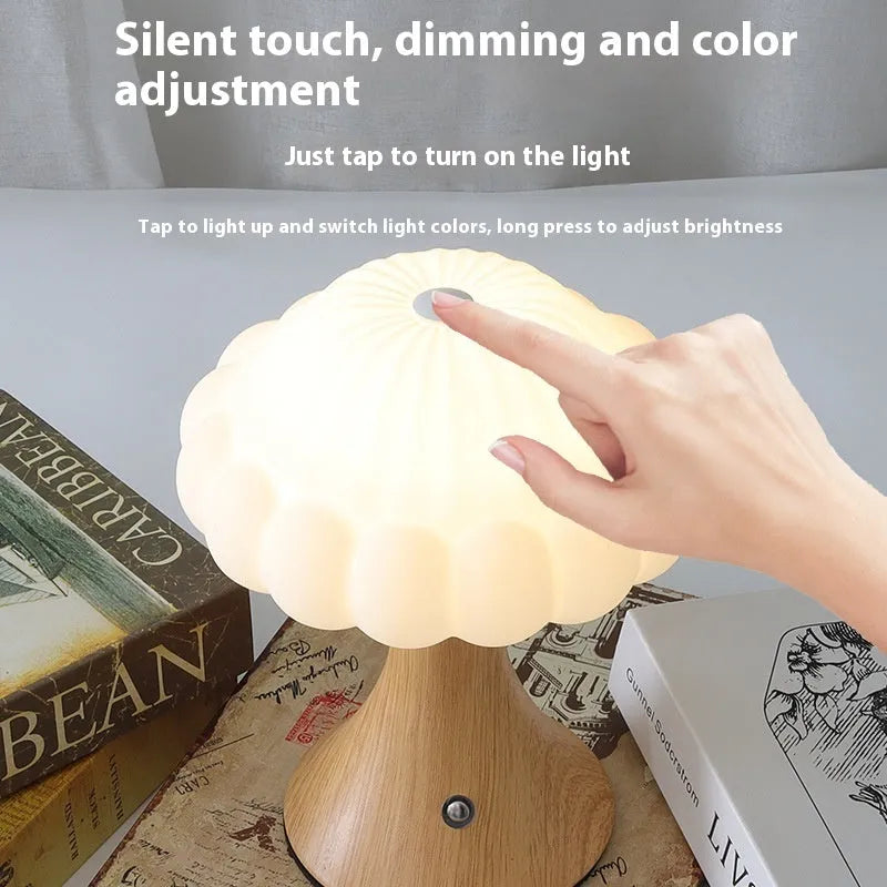 Small decorative mushroom-shaped night lamp in wood grain colour with touch control.