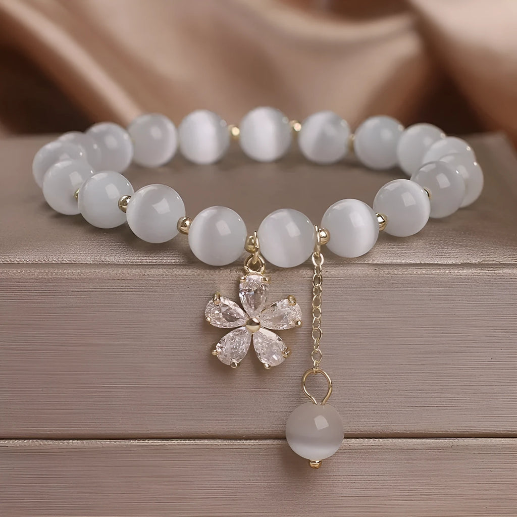 White cat's eye crystal bracelet with floral tassel and morganite safety buckle