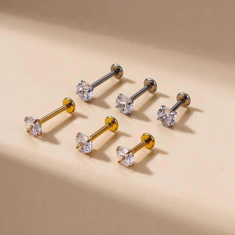Stainless steel inner rod ear bone stud with geometric shape and electroplated finish on silver background
