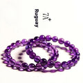 Natural Uruguayan amethyst bead bracelet with scattered polished crystals in deep violet hues on a white background.