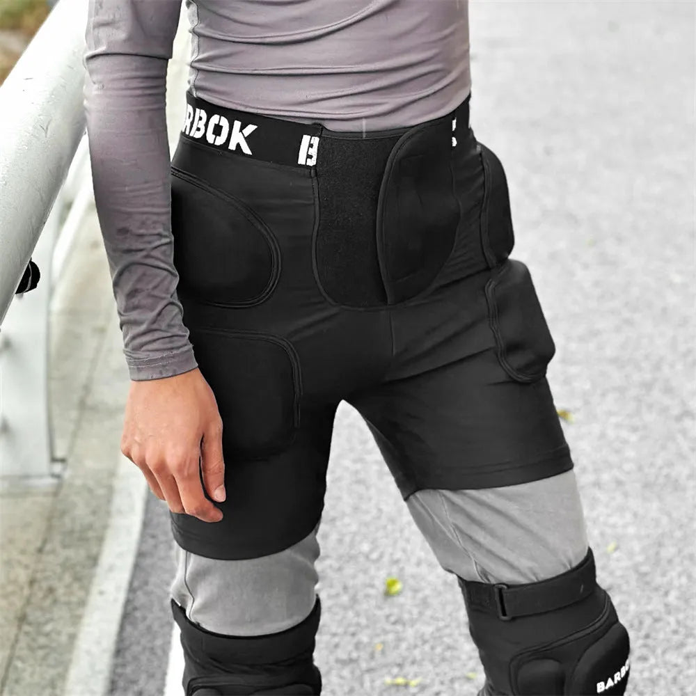 Black spandex hip protection pants with removable NBR foam padding for roller skating and skateboarding safety.
