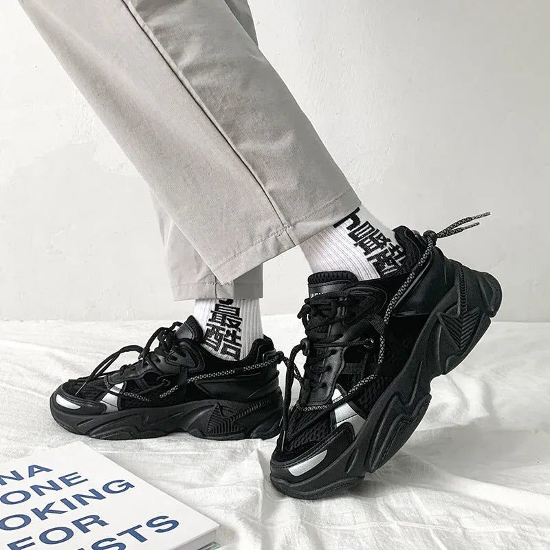 Men's Korean style platform dad shoes in black colour with lace-up front and mesh lining.