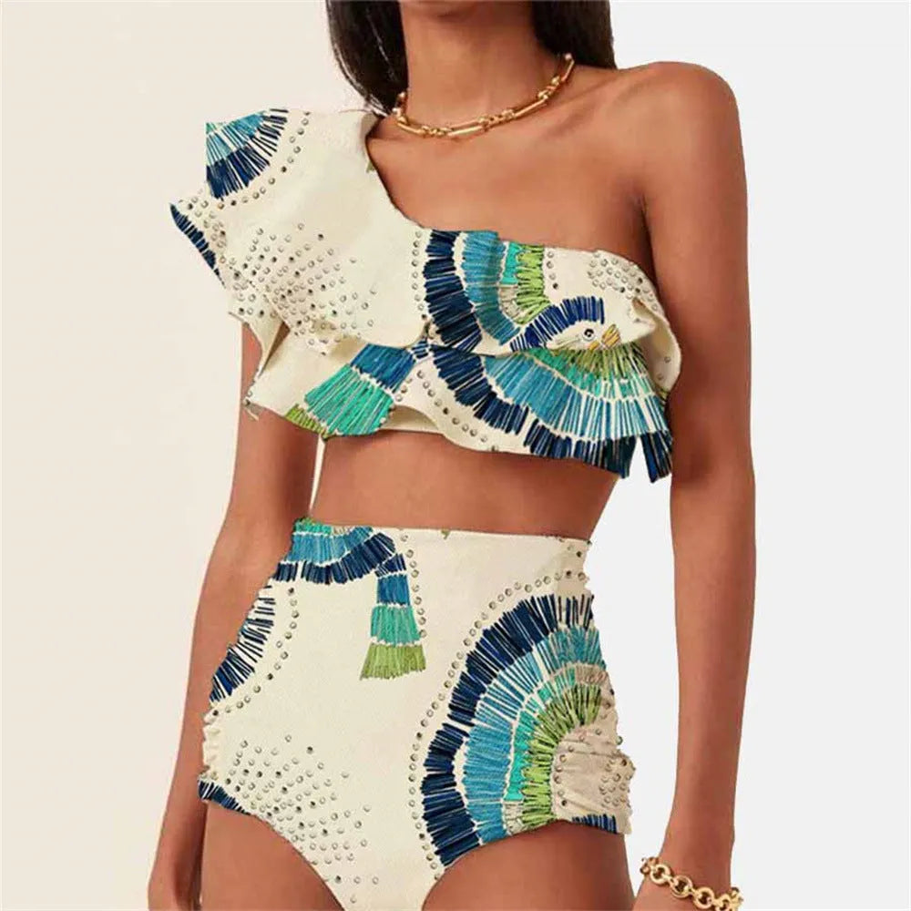 White women's one-shoulder bikini with a large lotus leaf design and split front.