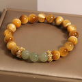 Natural yellow Tiger's Eye Hetian jade bracelet with gold gourd design and U-shaped form