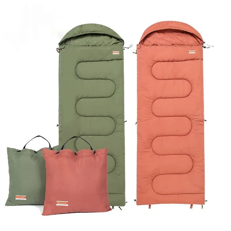 Outdoor cotton sleeping bag quilt shown in ochre and olive green colours, folded to show its ultra-light portable design.