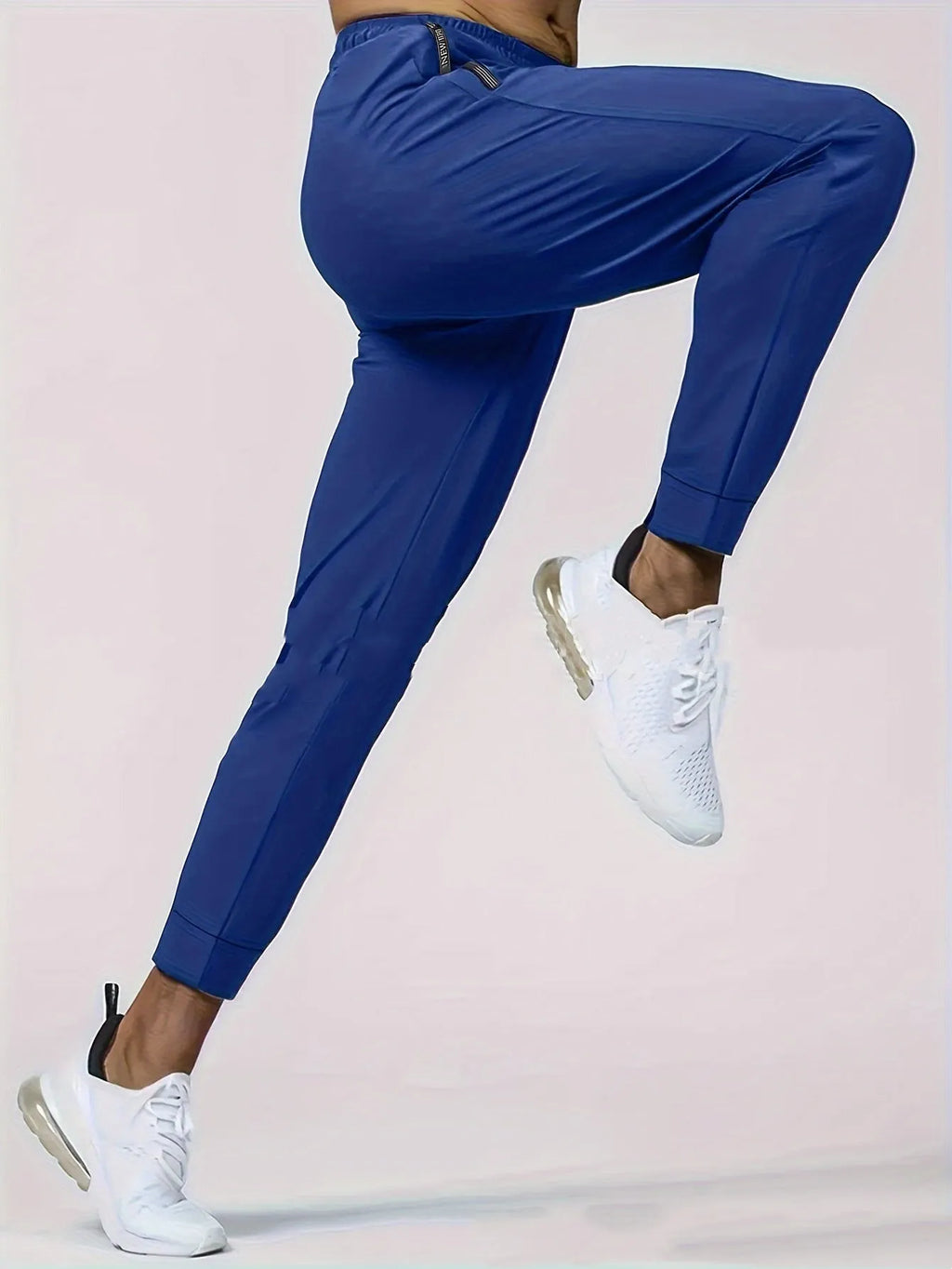 Men's loose mid waist jogging sports pants in black, grey, khaki, or blue, high elasticity nylon blend, sizes L to 7XL