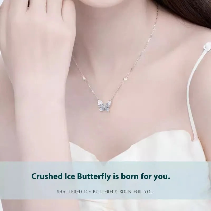 Close-up of a silver butterfly pendant on an adjustable O-ring chain, showing detailed wings and a 41-50 cm length.