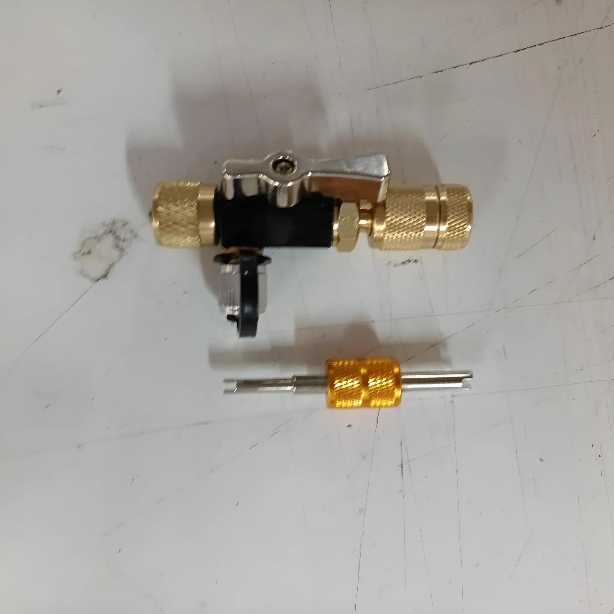 Metal vacuum valve core disassembly tool set with black and pink valve removers