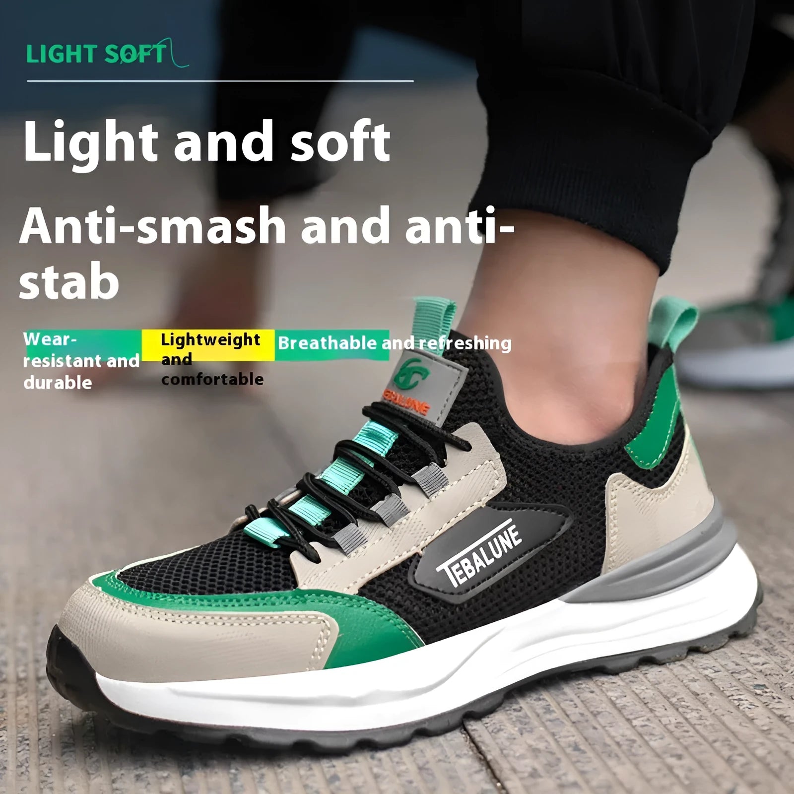 Black and green men's low-top steel toe safety shoes with a mesh upper and plastic toe cap.