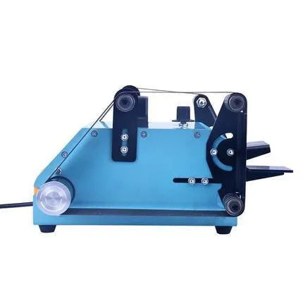 Blue desktop dual-axis belt sander with variable speed switch on a workbench.