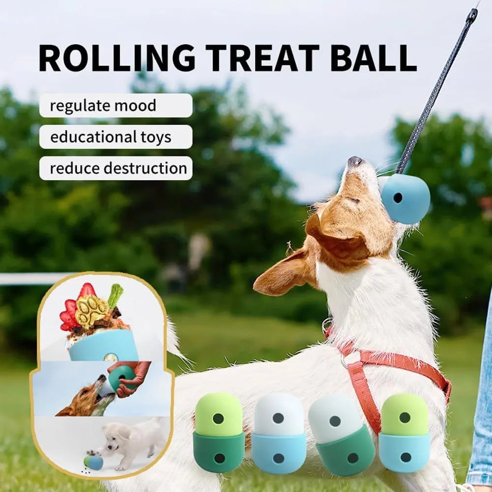 White and blue silicone dog treat puzzle ball toy on a wooden floor.