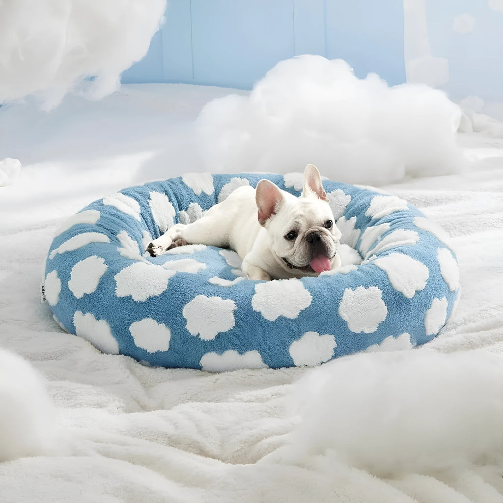 Round plastic dog bed in blue and white plaid pattern showing removable cover option