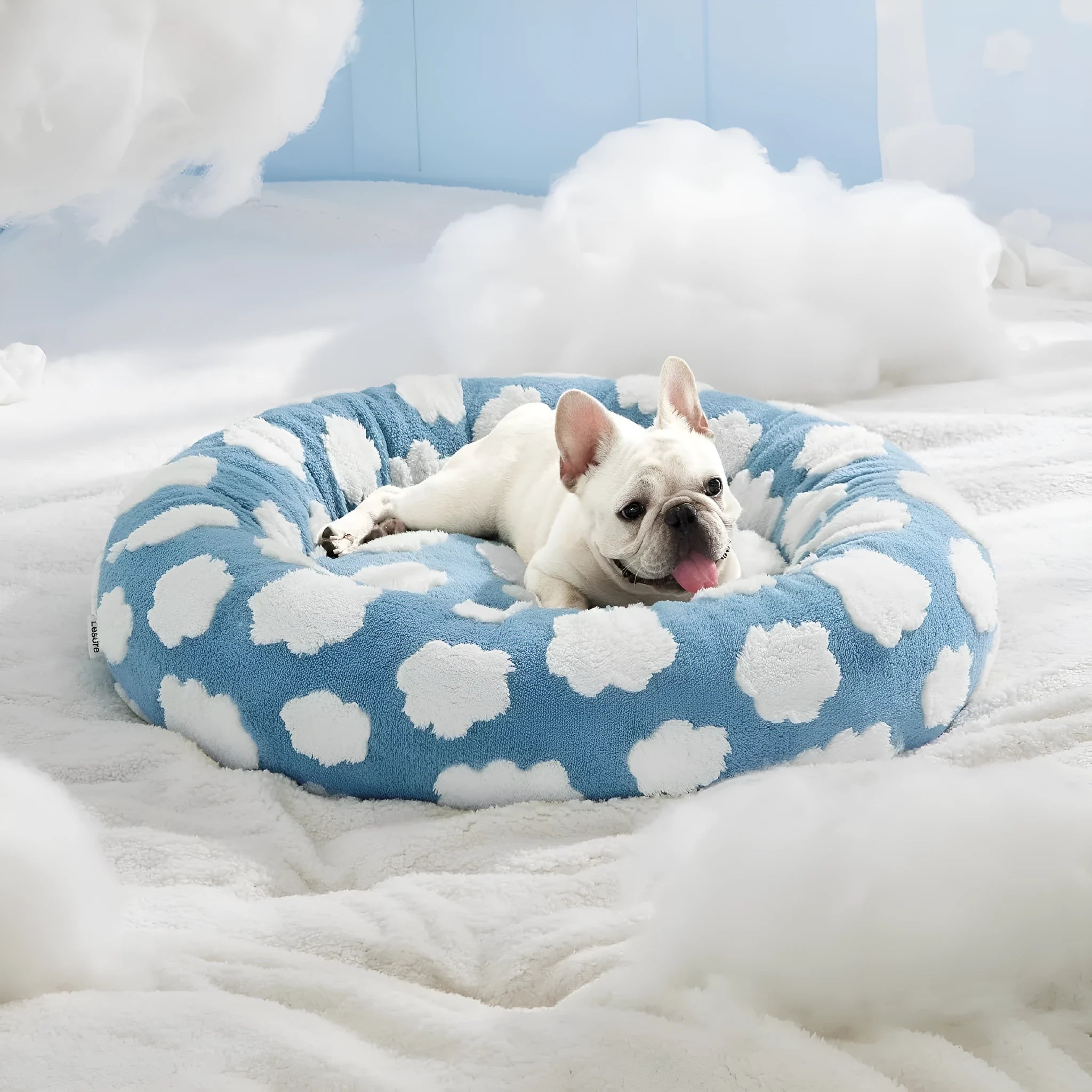 Round plastic dog bed in blue and white plaid pattern showing removable cover option