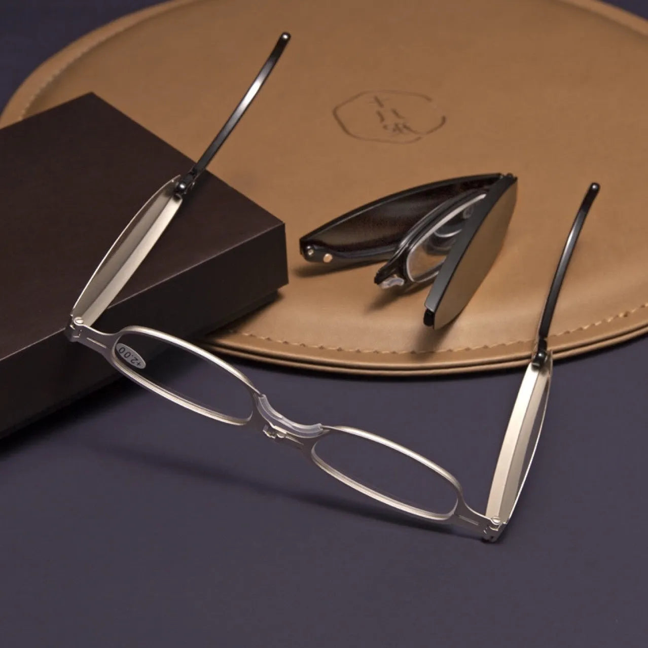 Folding presbyopic reading glasses in black frame shown open and folded with protective case