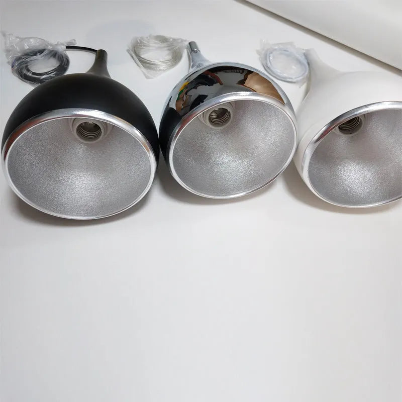 Iron minimalist chandelier lamp in black finish with three-head disc configuration for ceiling mounting