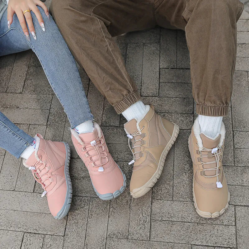 Unisex waterproof snow boots in black, khaki, or pink with round toe, lace-up front, and fleece lining.