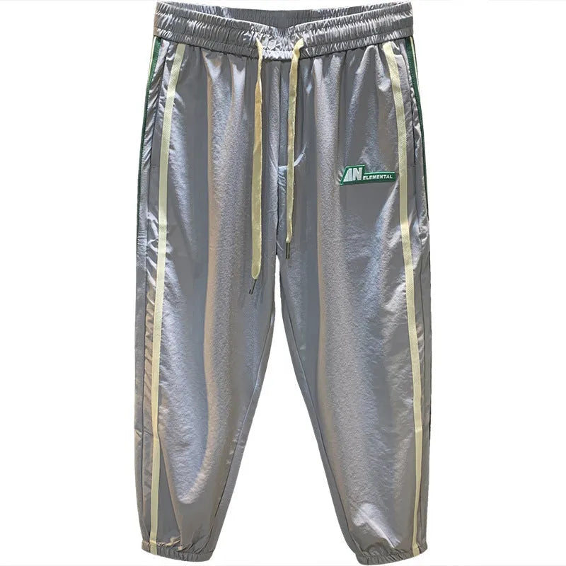 Men's black cotton harem pants with mid-waist design and relaxed leg fit