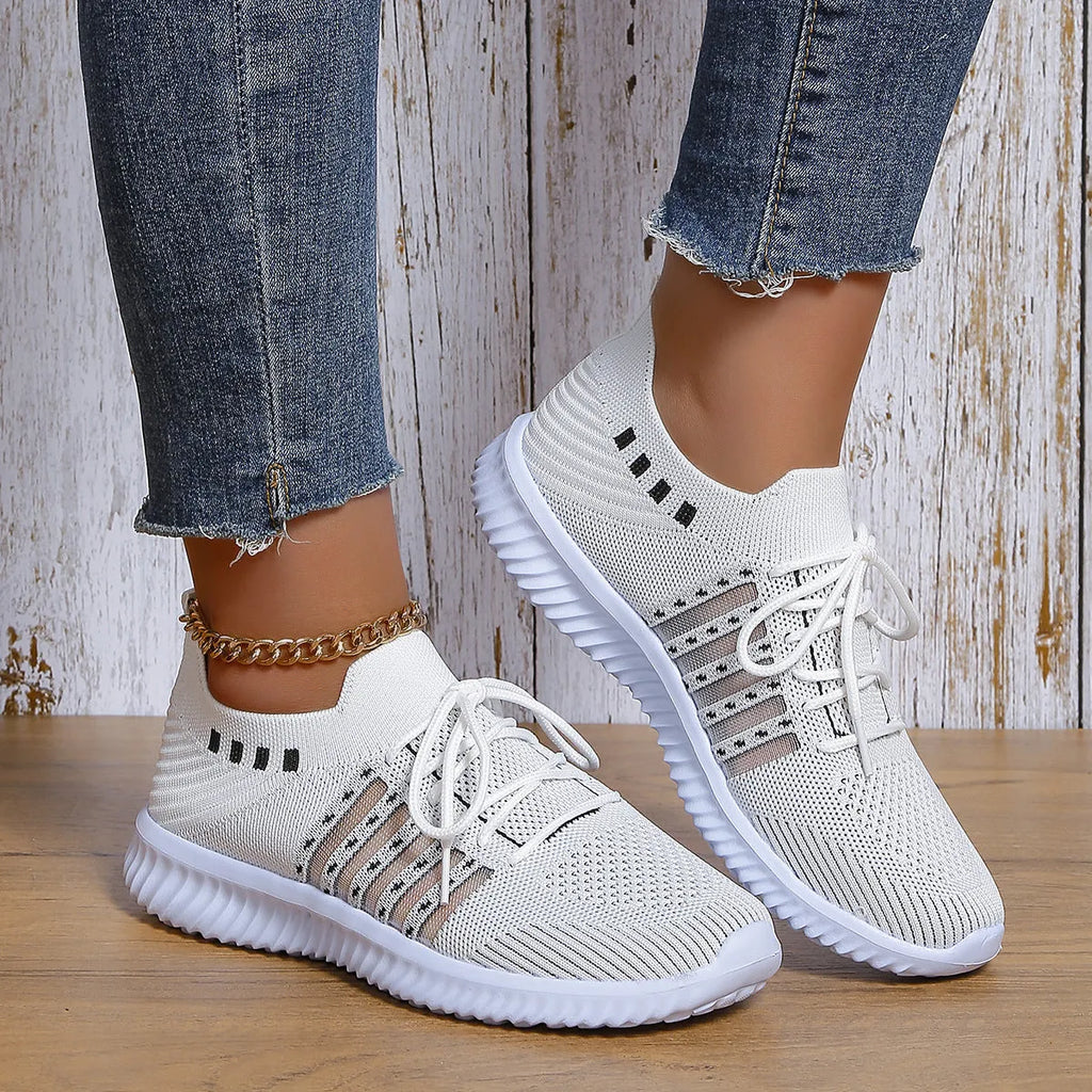 Beige lace-up mesh sneakers with round toe, rubber sole, and PU insole on a flat surface