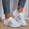 Beige lace-up mesh sneakers with round toe, rubber sole, and PU insole on a flat surface