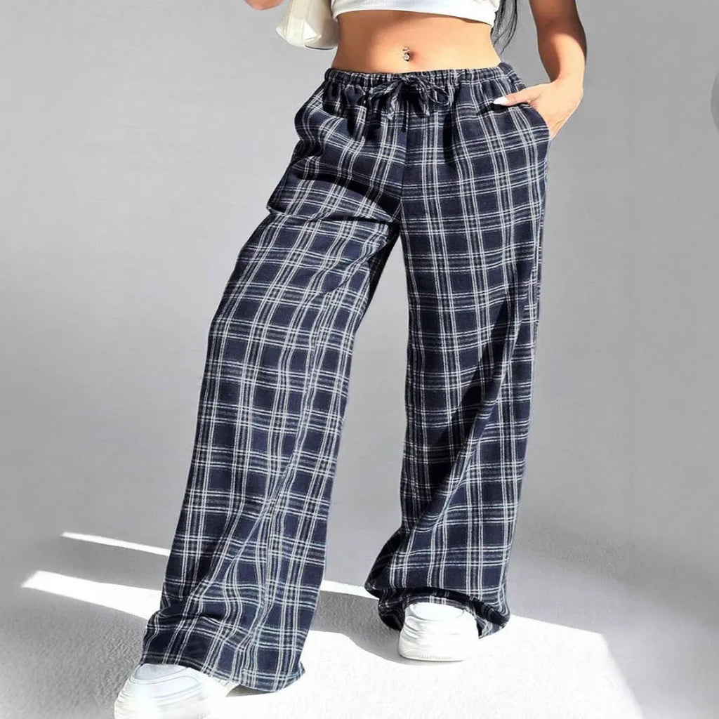 Women's loose fit plaid trousers with a drawstring waist and side pockets, shown in blue.