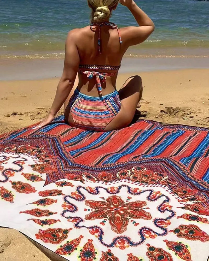Women's three-piece swimsuit set in pictured colour, showing cutout top, high-waist shorts, and short-sleeved cover-up coat laid flat.