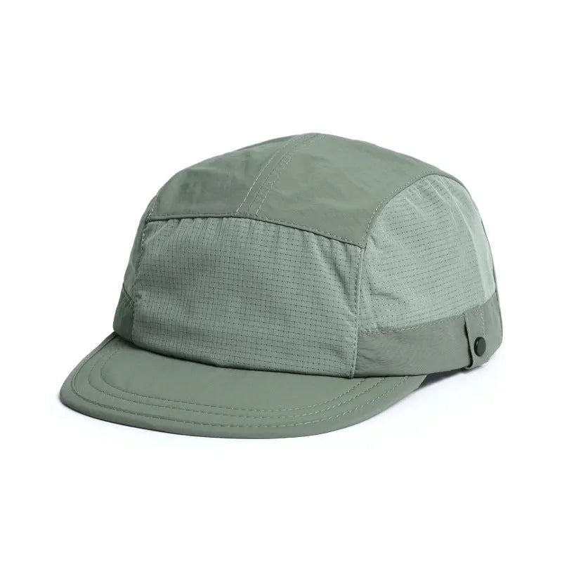 Breathable dome crown sun cap with a soft front tongue in Army Green colour on a wooden background.