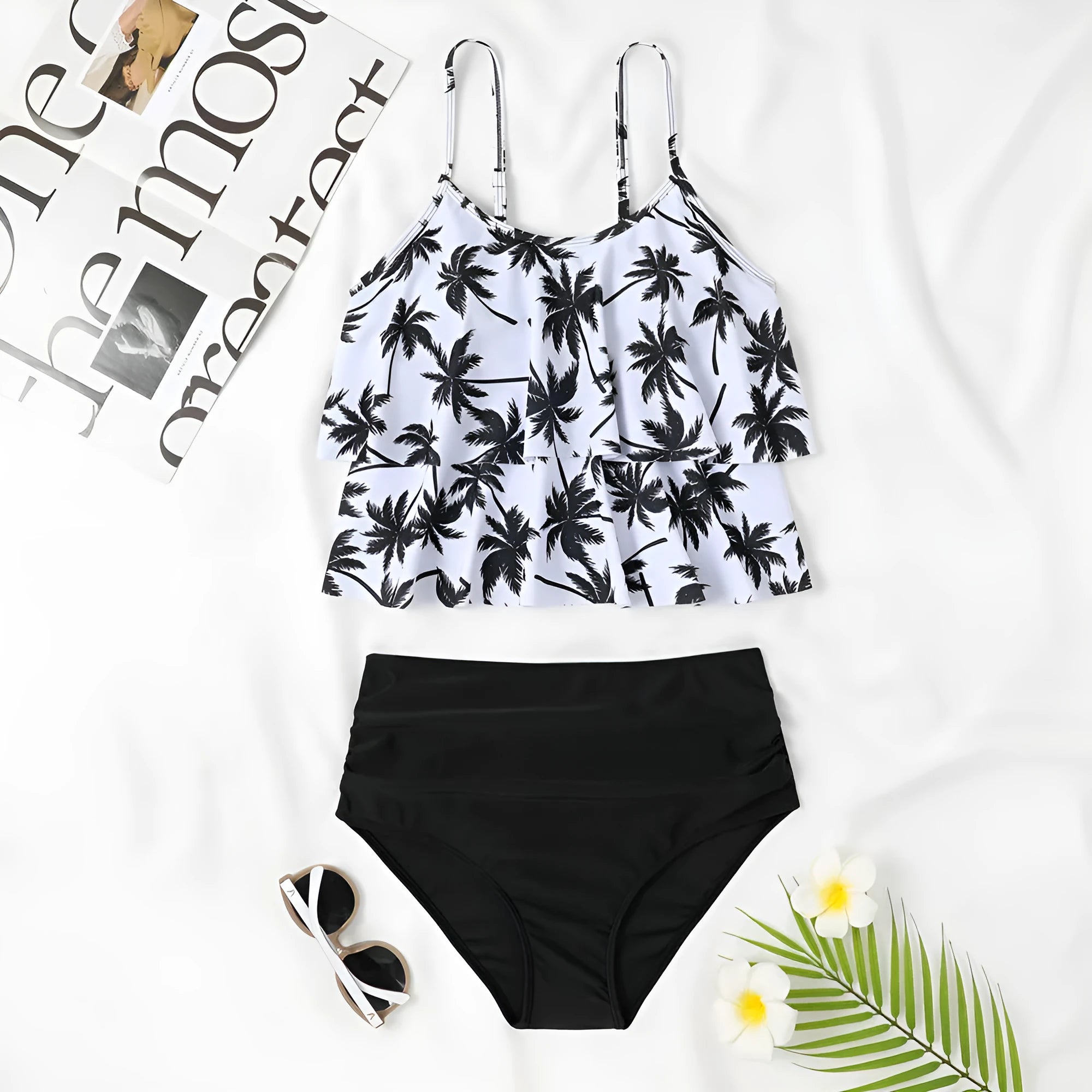 Black high-waist swimsuit briefs with a double-layer front and a matching sleeveless top on a mannequin.