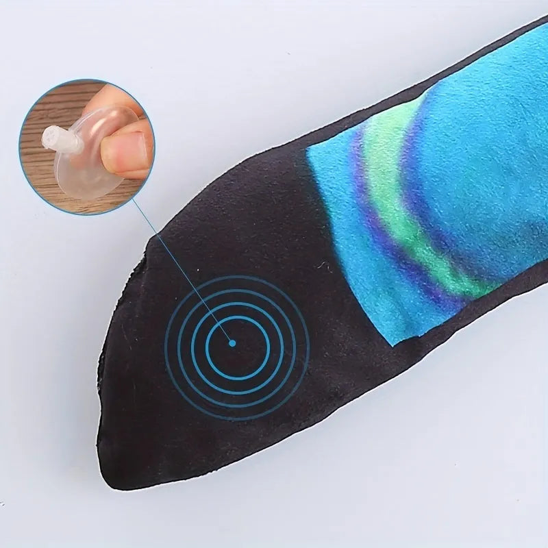 Multicolor stripe print snake plush squeaky toy for dogs on a white background.