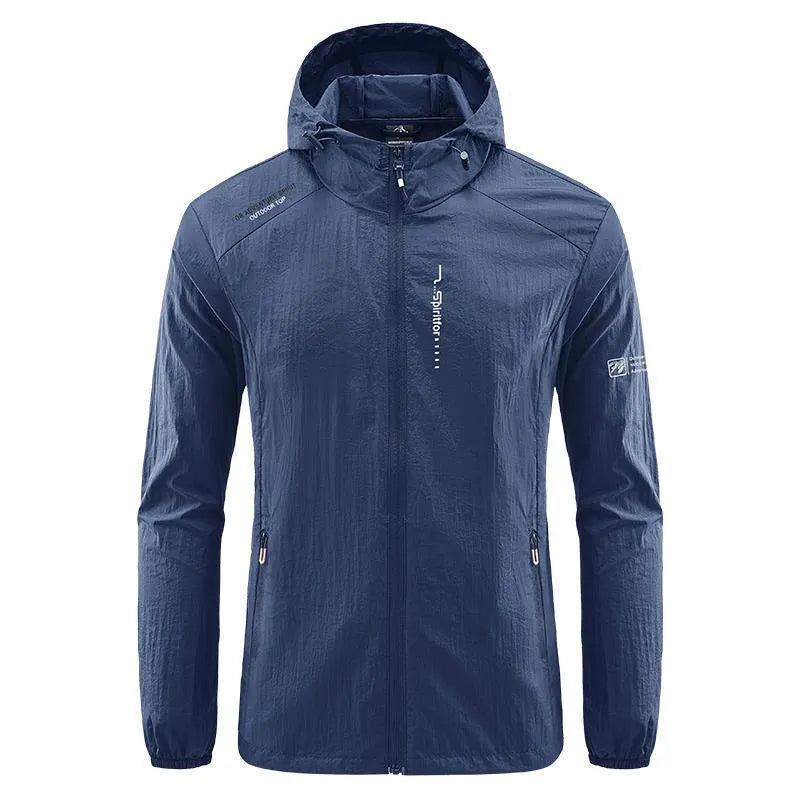 Man wearing a loose-fit light grey hooded nylon jacket for summer sun protection.