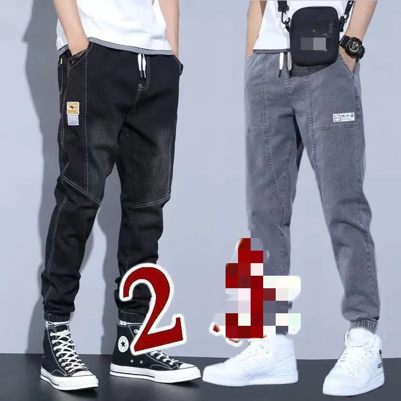 Two pairs of women's casual cotton jeans with mid waist and washed finish in grey and black