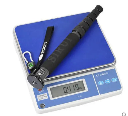 Black carbon fibre telescopic monopod for DSLR cameras, shown extended and collapsed.